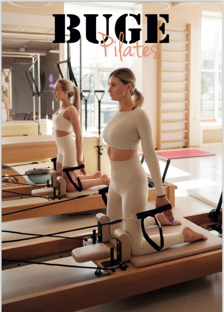 Fitness enthusiasts working out on premium buge cable machines.