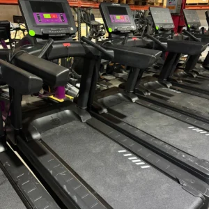 Pre-owned Life Fitness Integrity treadmills with C Console and current purple overlays in the BUGE warehouse