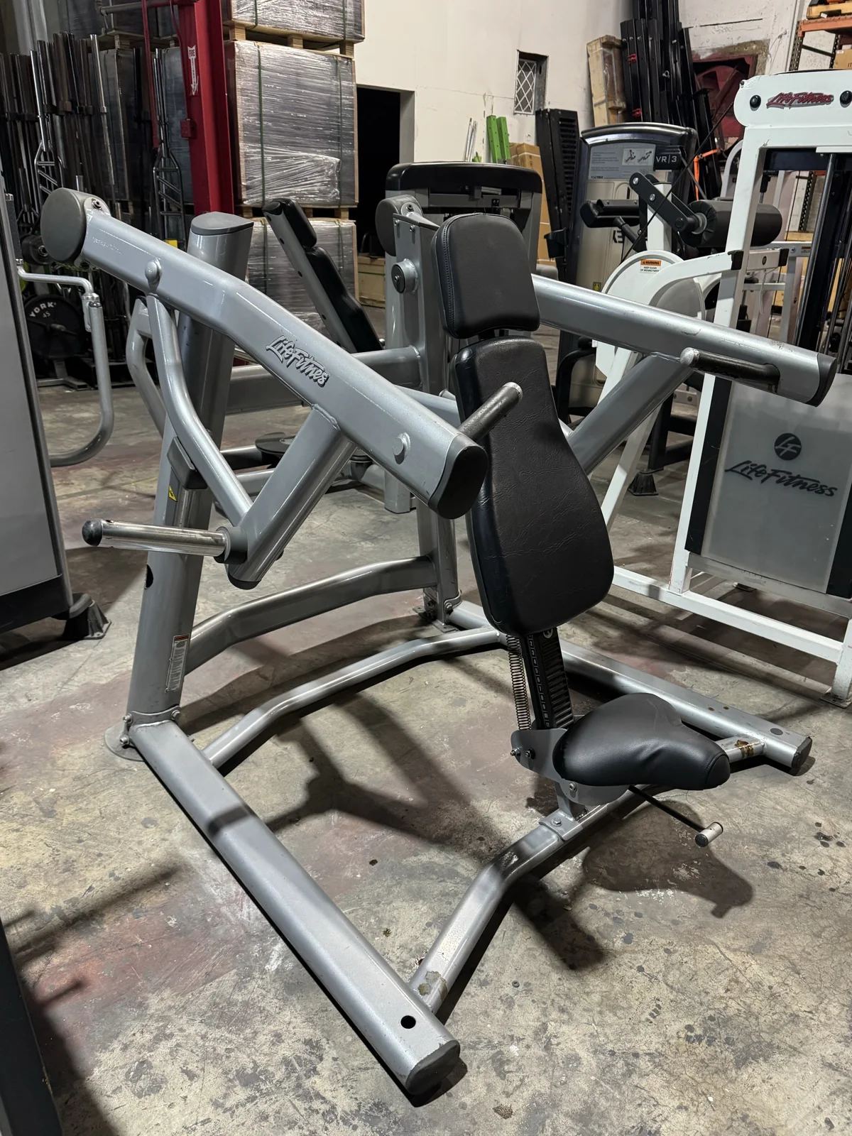 Pre-owned Life Fitness Signature Series plate-loaded shoulder press — angled view